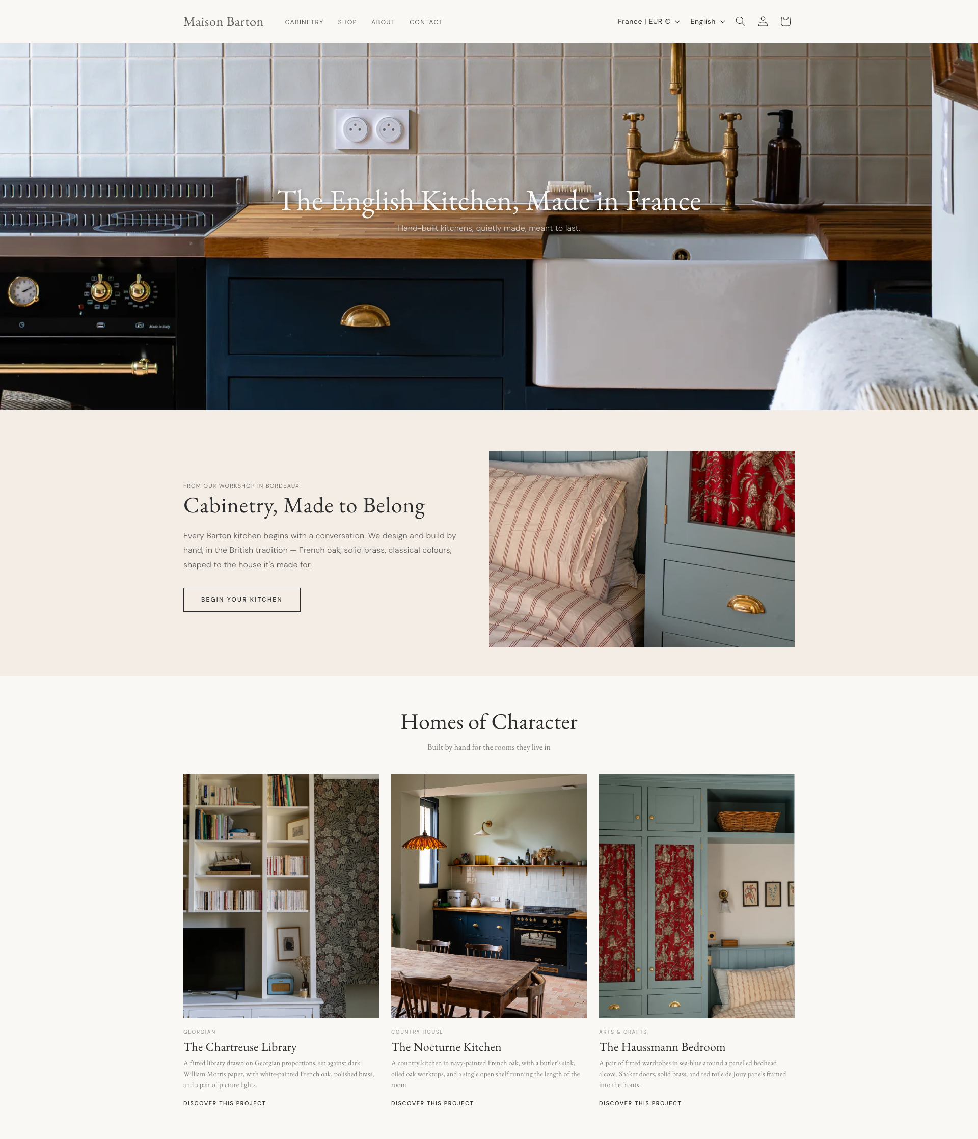 The Maison Barton homepage, with a navy kitchen and brass taps in the header and three featured projects below